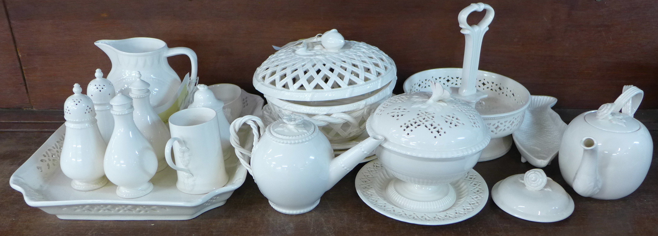 A collection of Leeds ware including two bowls with pierced lids, a 'basket', two small teapots,