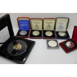 A collection of silver coins including commemorative crowns