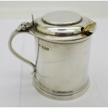 A silver mustard in the shape of a tankard, with blue glass liner, replacement spoon,