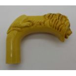 A walking stick handle depicting a lion