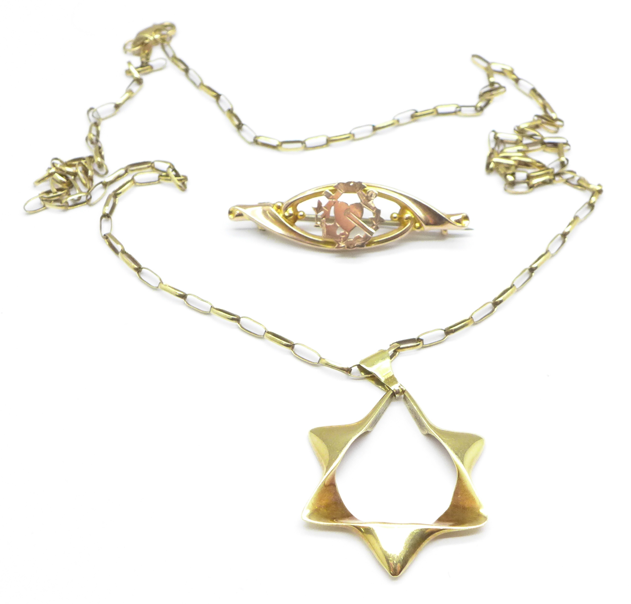 A 14ct gold Star of David pendant on a 9ct gold chain and a 9ct gold love heart brooch,
