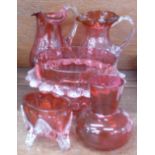 Five items of cranberry glass,