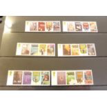 An album of forty-two Royal Mail mint stamp sets,