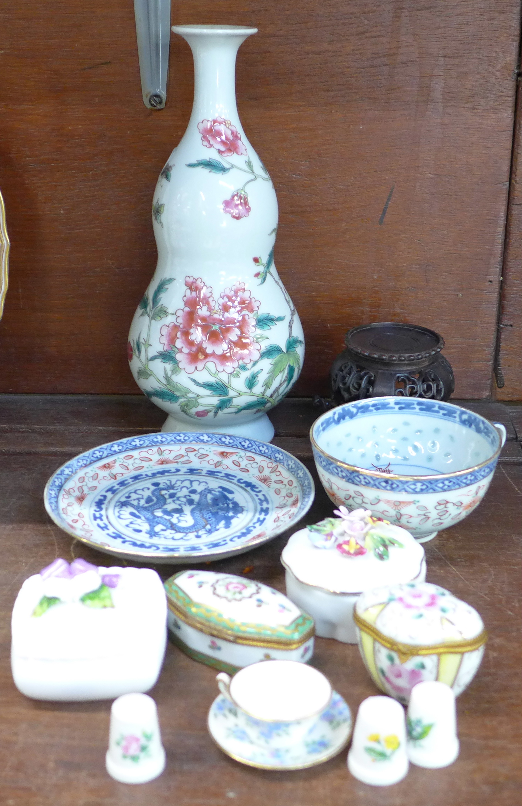 Trinket pots, an oriental vase, carved stand, etc.