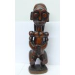 A carved African Fang tribe ancestral figure, tourist piece,