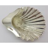 A silver shell shaped dish,