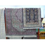 A sage ground rug and a small blue rug