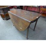 A George II oak drop-leaf dining table