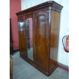 A Victorian mahogany fitted three door wardrobe