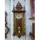 A 19th Century walnut double weight Vienna wall clock
