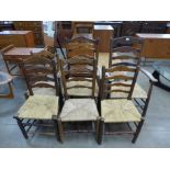 A Harlequin set of six George III provincial elm rush seated ladderback chairs