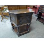 A 17th Century style carved oak credence cupboard