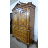 An 18th Century Dutch walnut and marquetry inlaid bombe cabinet