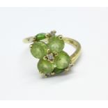 A 9ct gold, peridot and white stone ring, 2.