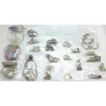 Twenty-five silver pendants and chains