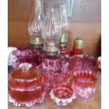 A collection of cranberry glass,