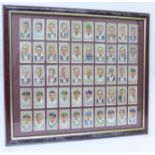 A framed set of fifty John Player Cricketers cigarette cards