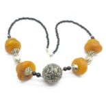 A necklace with large amber beads