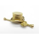 A 9ct gold top hat charm set with a garnet, mark worn, 4.