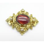 A Victorian cabochon garnet and pearl set brooch, tests as 15/18ct gold, gross total weight 14.