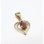 A 9ct gold and garnet pendant, 0.