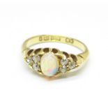 A Victorian 18ct gold, opal and diamond ring, Birmingham 1898, 3.