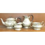 An Arts and Crafts four piece pewter teaset, marked Civic,