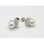 A pair of 18ct white gold set cultured pearl earrings,
