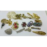 A collection of twenty brooches