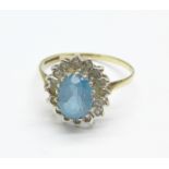 A 9ct gold, blue topaz and diamond ring, 1.