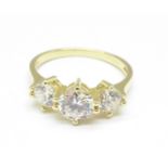 A 14ct gold white sapphire trilogy ring, 3g,