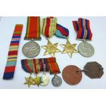 A set of four WWII medals, miniatures and dog tags to 15457 J.J.
