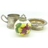 A plated coaster, a plated two handled mug and a Moorcroft table lighter,