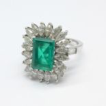 A platinum set, emerald and diamond cluster ring, purchased in 1964 in Rome, Fürst Jewellers,