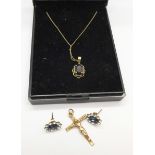 A 9ct gold crucifix, a 9ct gold chain with pendant and a pair of earrings, (crucifix 1.
