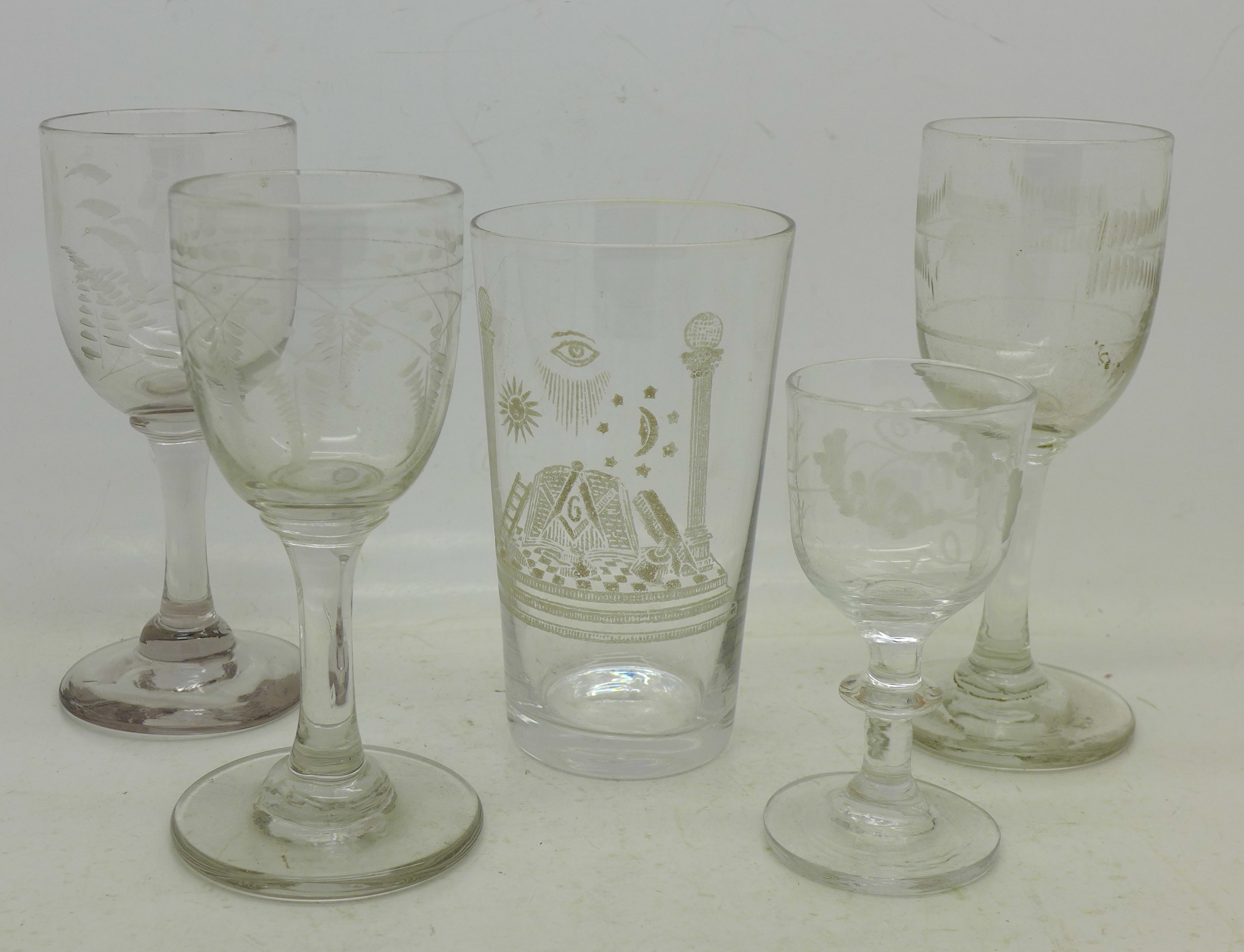 Four etched Georgian glasses and a Masonic glass