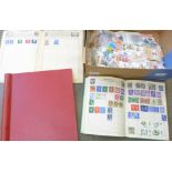 A collection of stamps and a Simplex Blank Album