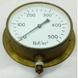 A brass pressure gauge