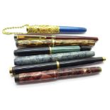 Seven fountain pens, two with 18k gold nibs and five with 14k gold nibs, Waterman, Pelikan, Summit,