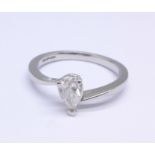 A platinum set pear brilliant cut diamond solitaire ring, 0.