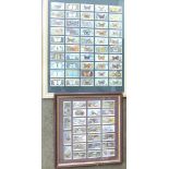 Two framed sets of collectors cards,