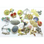 Twenty-three costume brooches and two pairs of earrings