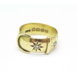 An 18ct gold, diamond set buckle ring, 6.