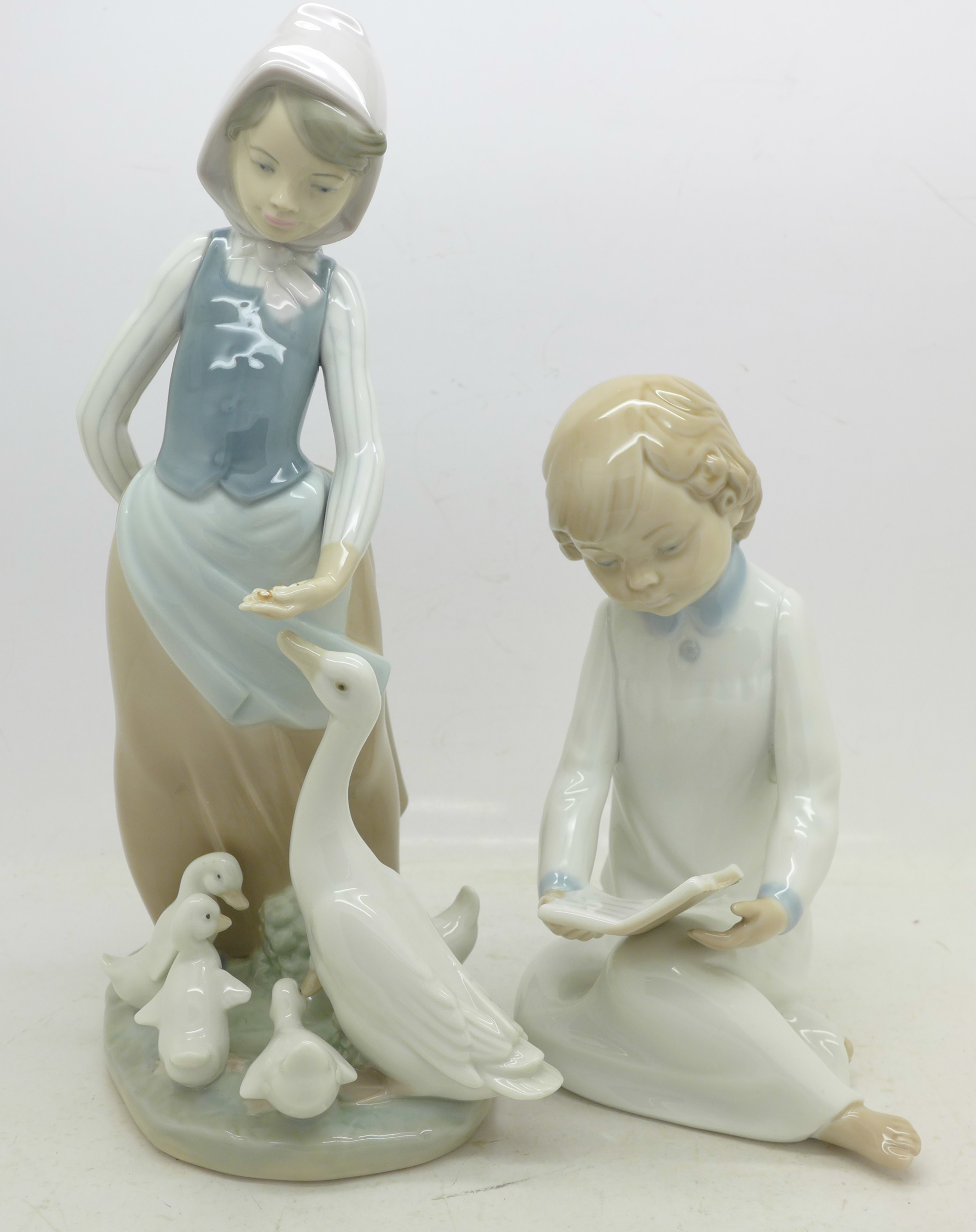 A Lladro figure of a lady with geese and a Nao figure