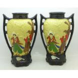 A pair of Embosa Ware Cyples Old Pottery vases,