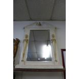 An Egyptian Revival white painted mirror