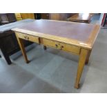 An Edward VII oak two drawer library table