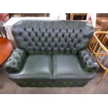 A green leather Chesterfield settee