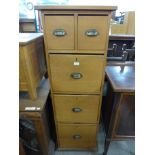 A pine five drawer filing cabinet