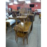 An Ercol drop-leaf table and four chairs